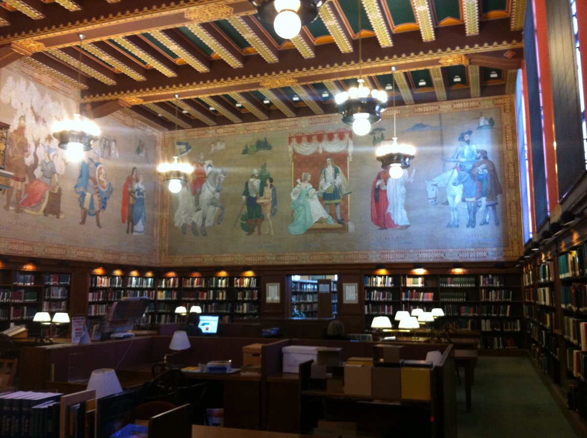Main research room, mural wall, desks, and shelves