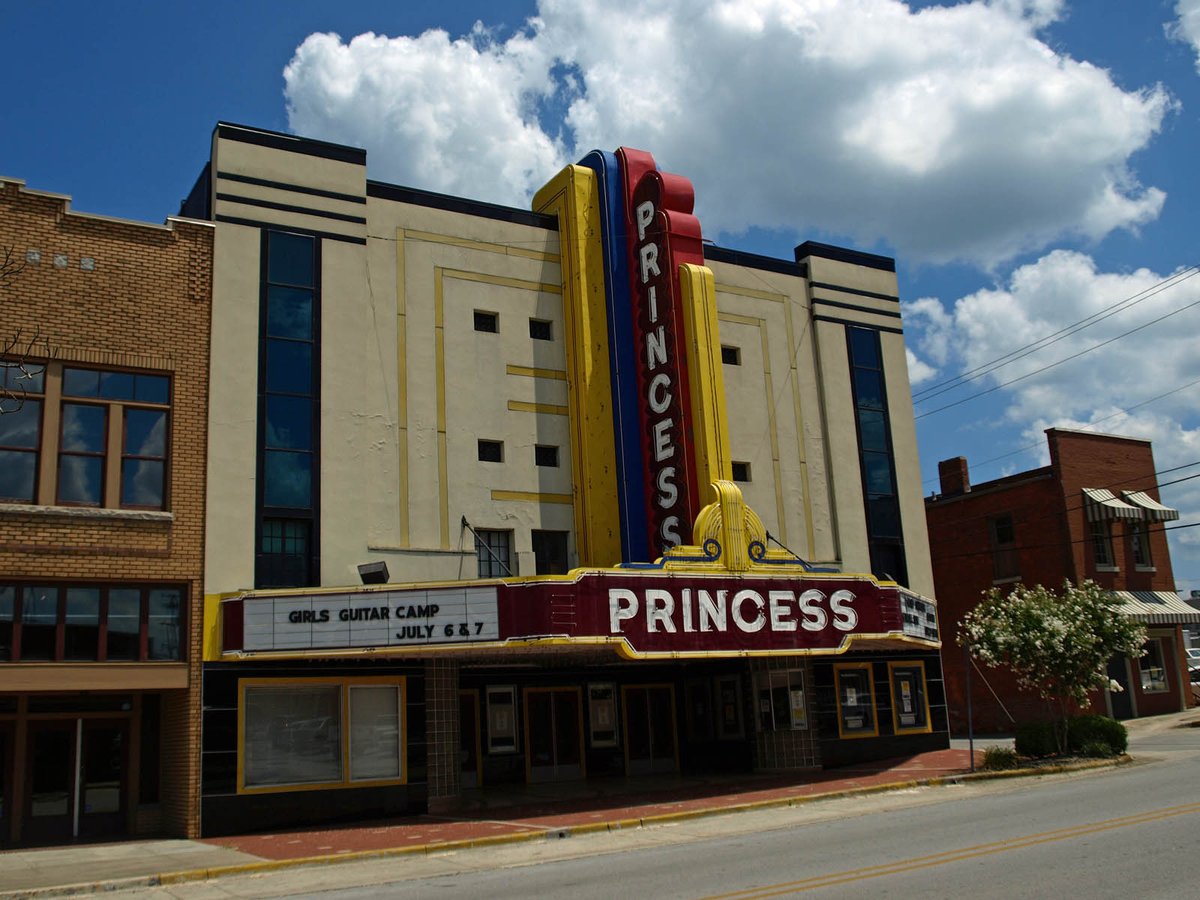 Princess Theatre in Decatur, cream-colored front, vertical sign, and doors under the marquee
