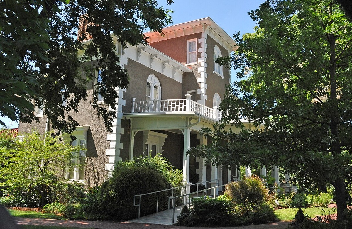 Peel House in Bentonville, tower, white porch, and shaded door