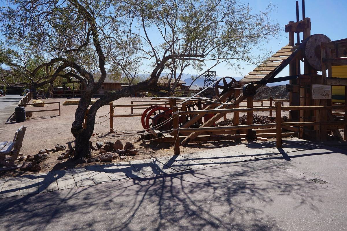 Old mining machinery beside a walkway at Calico Ghost Town