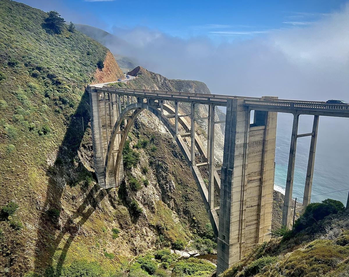 Bixby Creek Bridge's concrete arch spanning a steep canyon above the Big Sur coast