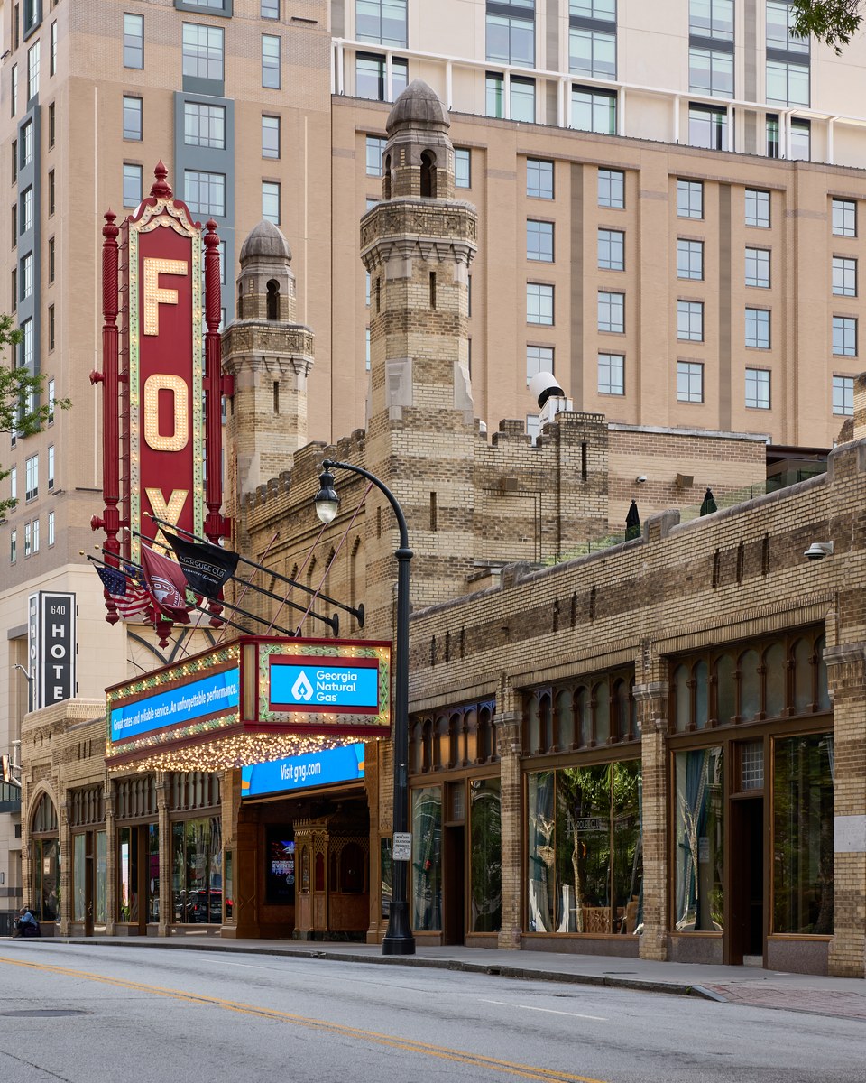 Fox Theatre in Atlanta, the theatre front, the vertical sign reading FOX, the minaret-like towers, and the marquee