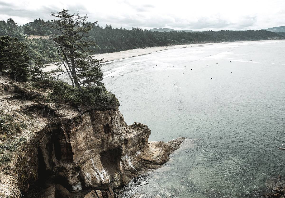 Rocky headland and surf at Devils Punchbowl State Natural Area in Otter Rock, Oregon
