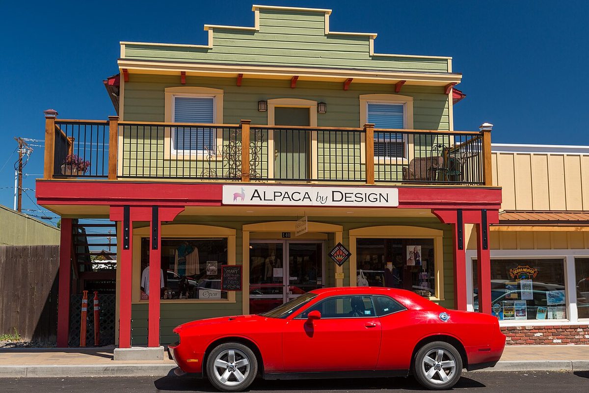 A false-front Western-style storefront with a second-floor balcony in downtown Sisters, Oregon