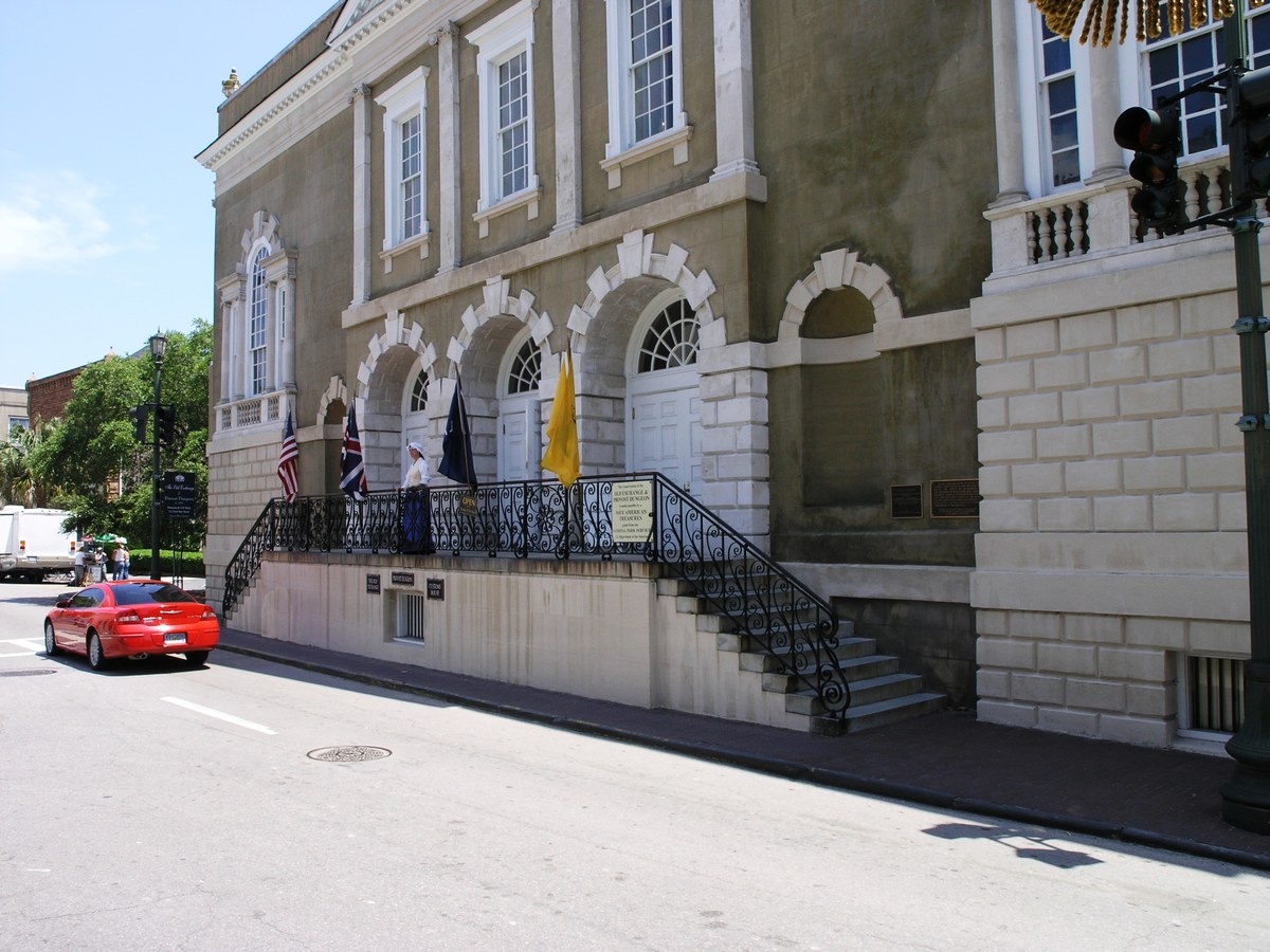 Old Exchange in Charleston, the stucco front, the arched openings, the white doors, and the outside stair