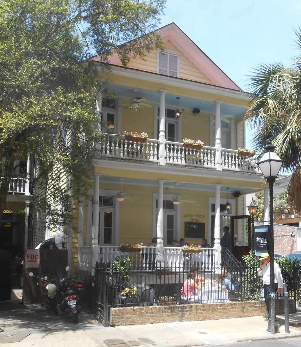 Poogan's Porch in Charleston, the yellow house, the porches, and the tables along Queen Street